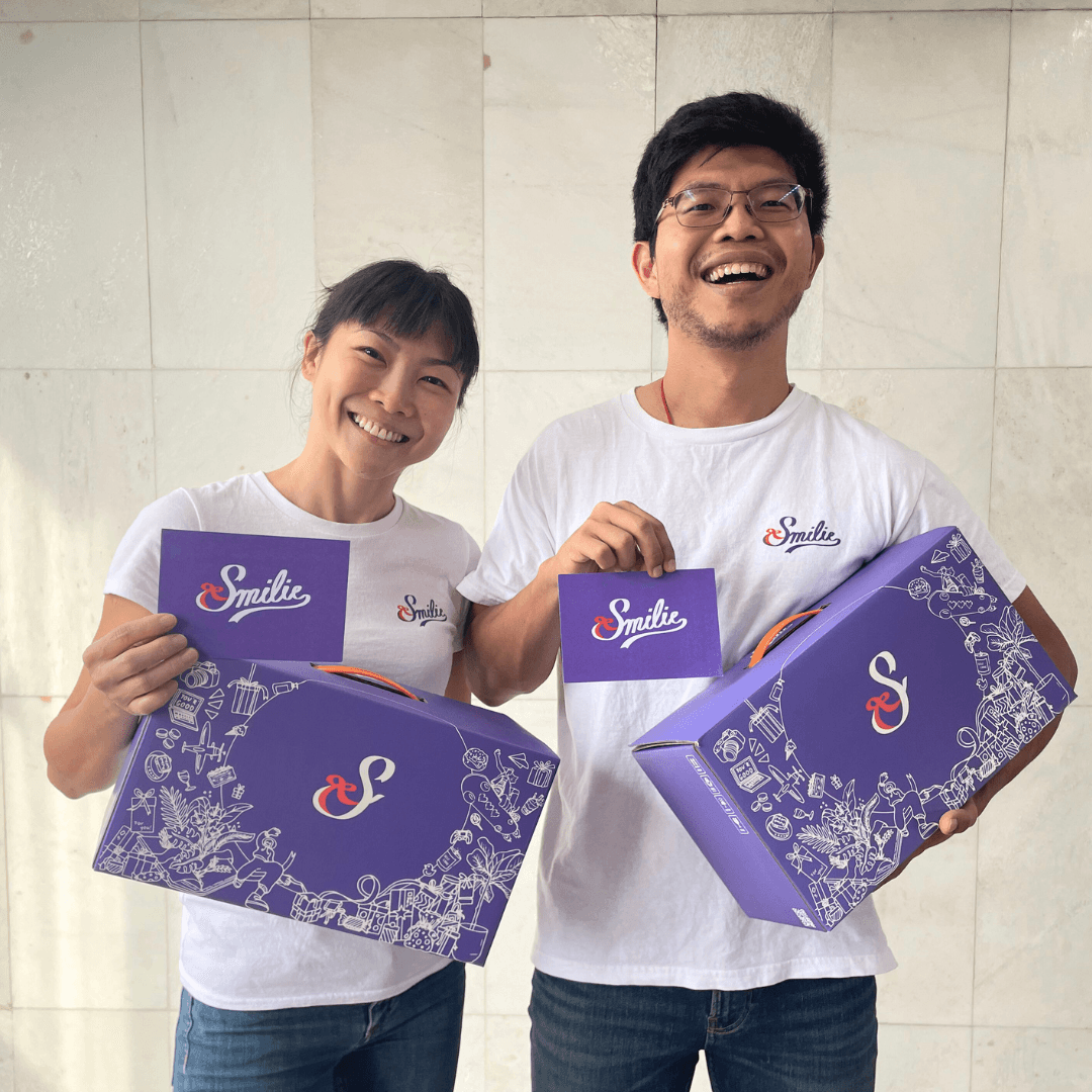 Smilie founders holding branded gift boxes