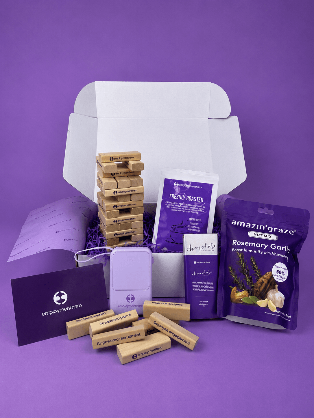New employee unboxing a branded onboarding gift set